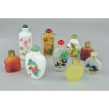 NINE SCENT BOTTLES, to include three of carved floral design, the remaining painted with Oriental