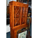 A YEW WOOD GLAZED TWO DOOR DISPLAY CABINET, above two drawers, glazed corner cupboard and a