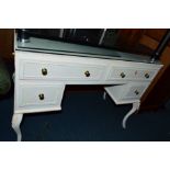 A PAINTED AND GILT TWO PIECE BEDROOM SUITE, comprising of a dressing table and a chest of five