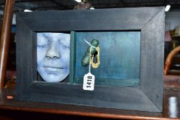 TOM MILLARD 1996, a boxed sculptor of a face and keyhole, approximate size width 33cm x depth 9cm