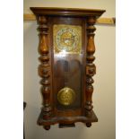 A 20TH CENTURY OAK CASED VIENNA WALL CLOCK, brass dial with Arabic numerals, approximate height