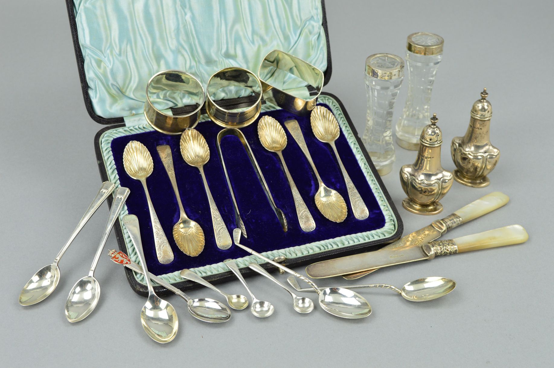 A LATE VICTORIAN CASED SET OF SIX SILVER COFFEE SPOONS AND MATCHING SUGAR TONGS, shell shaped bowls,