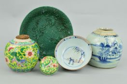 A CHINESE FAMILLE VERT YELLOW GROUND GINGER JAR AND COVER, painted with Buddhist lions and lotus,