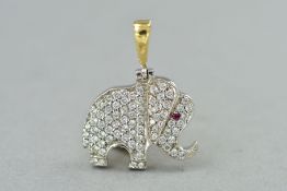 AN ELEPHANT PENDANT, the body set with cubic zirconia and a ruby eye, length 25mm, weight 4.5 grams