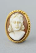 A CAMEO PENDANT, of oval outline, the cameo carved to depict a lady in profile to the rope twist