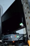 A SAMSUNG 32' FSTV, a video player and a Samsung Digibox (two remotes) (30
