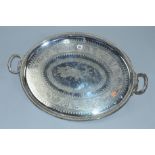 A LATE VICTORIAN ELKINGTON & CO SILVER PLATED TWIN HANDLED OVAL TRAY, foliate engraved decoration,