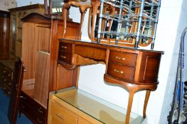 A YEW WOOD FOUR PIECE BEDROOM SUITE, comprising of a two door wardrobe with two long drawers, a