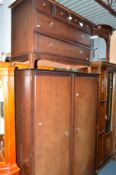 A STAG MINISTRAL FOUR PIECE BEDROOM SUITE, comprising of a two door wardrobe, dressing table with