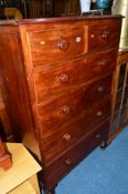 A TALL VICTORIAN MAHOGANY CHEST, with two short and four long drawers with turned handles on