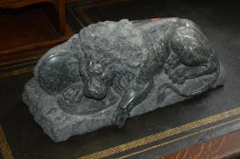 A 20TH CENTURY GREEN MARBLE FIGURE OF A RECUMBANT LION, apprioximate width 44cm