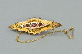 A LATE VICTORIAN RUBY AND SEED PEARL BROOCH, measuring approximately 42mm in length applied bead and