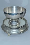 A LATE 19TH/EARLY 20TH CENTURY MIRRORED AND SILVER PLATED WEDDING CAKE STAND, of circular form,