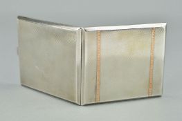 A GEORGE V SILVER AND GOLD INLAID RECTANGULAR CIGARETTE CASE, engine turned decoration, gilt