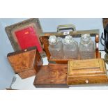 A THREE BOTTLED TANTALUS, a tea caddy (missing interior) a stationery box (s.d), a photoframe (s.