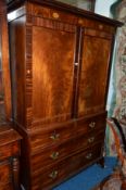 A GEORGIAN FLAME MAHOGANY AND SHELL INLAID LINEN PRESS, the double panelled doors revealing four