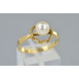 A 9CT GOLD CULTURED PEARL RING, designed as a central cultured pearl above an open wavy mount,