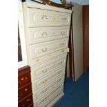 TWO CREAM TWO DOOR WARDROBES (one dismantled), two matching chest of drawers and another chest of