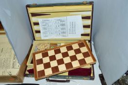 A SUITCASE CONTAINING GAMES COMPENDIUM, to include chess, backgammon etc