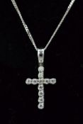 A CROSS PENDANT, the cross set with circular cubic zirconia suspended from a fine curb link chain,
