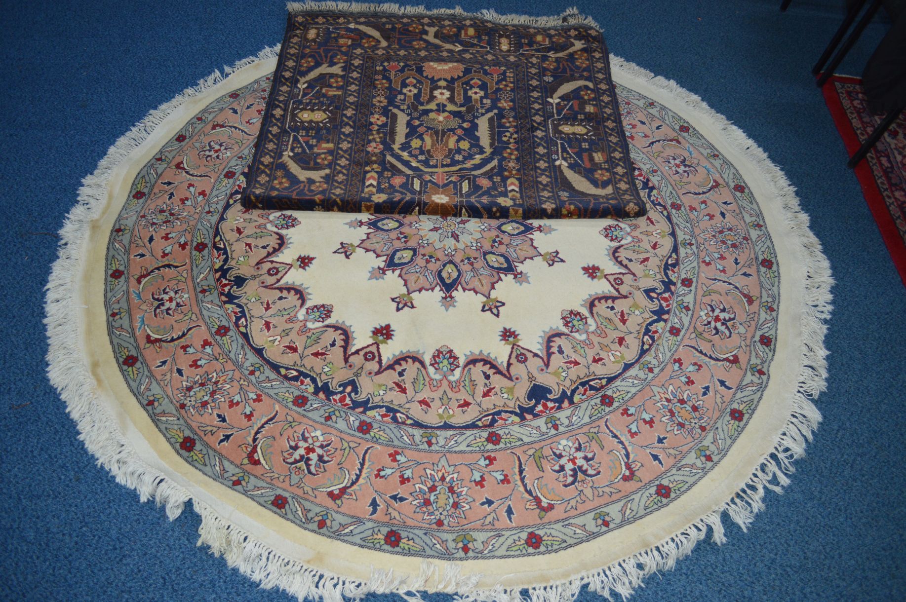 A 20TH CENTURY RED AND BLACK GROUND WOOLLEN CARPET SQUARE, with foliate and animal designs, (heavily - Image 4 of 4