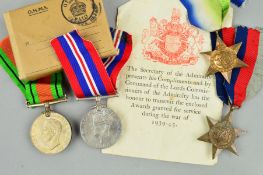 AN ORIGINAL BOXED NAVAL WWII GROUP OF MEDALS, (loose), 1939-45 and Atlantic Stars, Defence & War
