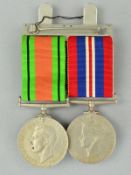 TWO WWII MEDALS, on a wearing bar, War & Defence medal, un-named as issued