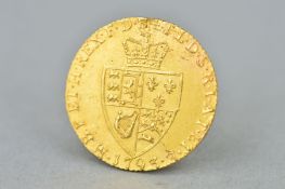 A GOLD GEORGE III GUINEA 1793, 22K, approximate weight 8.4 grams, in high grade with a tiny abrasion