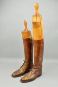A PAIR OF KNEE LENGTH VROWN COLOURED RIDING BOOTS, possibly WWI vintage, possibly an officer, they
