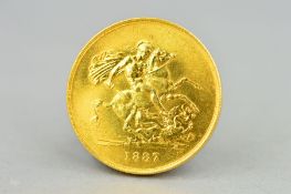 A GOLD FIVE POUND 1887 VICTORIA COIN, very good grade, with a tiny amount of rubbing under