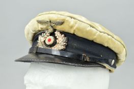 A WWII GERMAN 3RD REICH KRIEGSMARINE VISOR CAP, silver bullion edges, with both cap devices