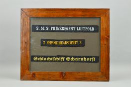 A GLAZED FRAME CONTAINING THREE GERMAN 3RD REICH KRIEGSMARINE CAP TALLIES, SMS Prinzregent Luitpold,