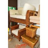 A WICKER FOUR PIECE CONSERVATORY SUITE comprising of a two seater sofa, chair, coffee table and