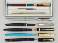 A PARKER DUOFOLD in black and gold, a parker in turquoise with rolled gold cap, a parker 21 in black