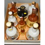EIGHT BELLS WHISKY CERAMIC DECANTERS and one Rutherford's Whisky Decanter, contents ranging from one