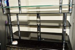 A BLACK GLASS AND CHROME THREE TIER TV STAND, width 110cm