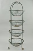 A GREEN PAINTED METAL FOUR TIER VEGETABLE RACK, circular removable baskets, on scrolled feet, height