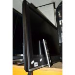 A SONY 32' LCD TV and heavy duty wall bracket (no stand, remote)