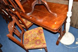 A VICTORIAN WALNUT CENTRE TABLE on a stretchered base, width 128cm x depth 65cm x height 70cm,