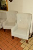 A PAIR OF OATMEAL UPHOLSTERED ARMCHAIRS with a footstool (3)