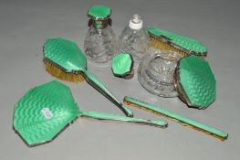 A 1930'S GREEN ENAMEL AND SILVER BACKED DRESSING TABLE SET, maker D M Co, Birmingham 1934-38, some