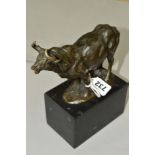 A REPRODUCTION BRONZE FIGURE OF A BULL, mounted on a black marble plinth, approximate height 21cm