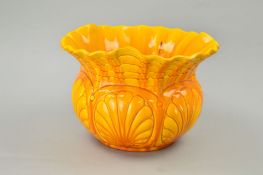A BRETBY POTTERY JARDINIERE, yellow glaze frilled rim, moulded with a design of wavy lines above