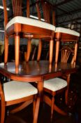 A REPRODUCTION MAHOGANY EXTENDING PEDESTAL TABLE, one additional leaf and four chairs (5)