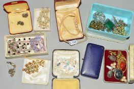 A TIN CONTAINING A SELECTION OF COSTUME JEWELLERY, to include a Danish flower brooch by Hermann