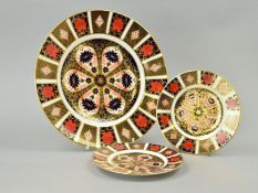 THREE ROYAL CROWN DERBY IMARI PLATES, '1128' pattern, approximate diameters 26.5cm and two 16cm (3)