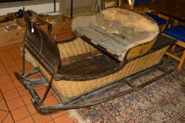 A 19TH CENTURY 'TROIKA' HORSE DRAWN SLEIGH, in need of restoration, fitted with part upholstered