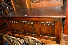 AN OAK LINENFOLD BLANKET CHEST