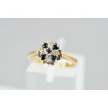 A MID TO LATE 20TH CENTURY SAPPHIRE AND DIAMOND CLUSTER RING, ring size J, hallmarked 9ct gold,