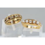 TWO DRESS RINGS, the first a 9ct gold red and colourless paste eternity ring, hallmarked